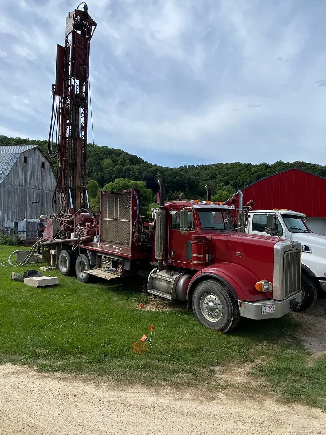 A drilling rig boring a residential water well