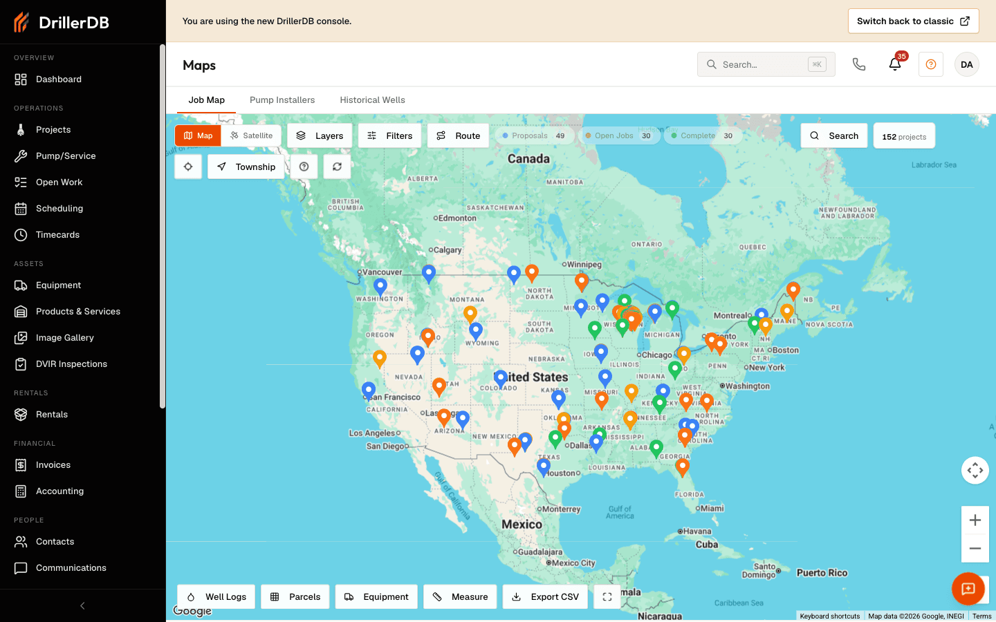 The Job Map showing projects and pump/service work across the United States as color-coded pins, with the Job Map / Pump Installers / Historical Wells tabs, a top toolbar (Map, Satellite, Layers, Filters, Route, and status filters for Proposals, Open Jobs, and Complete), and a bottom toolbar with Well Logs, Parcels, Equipment, Measure, and Export CSV.
