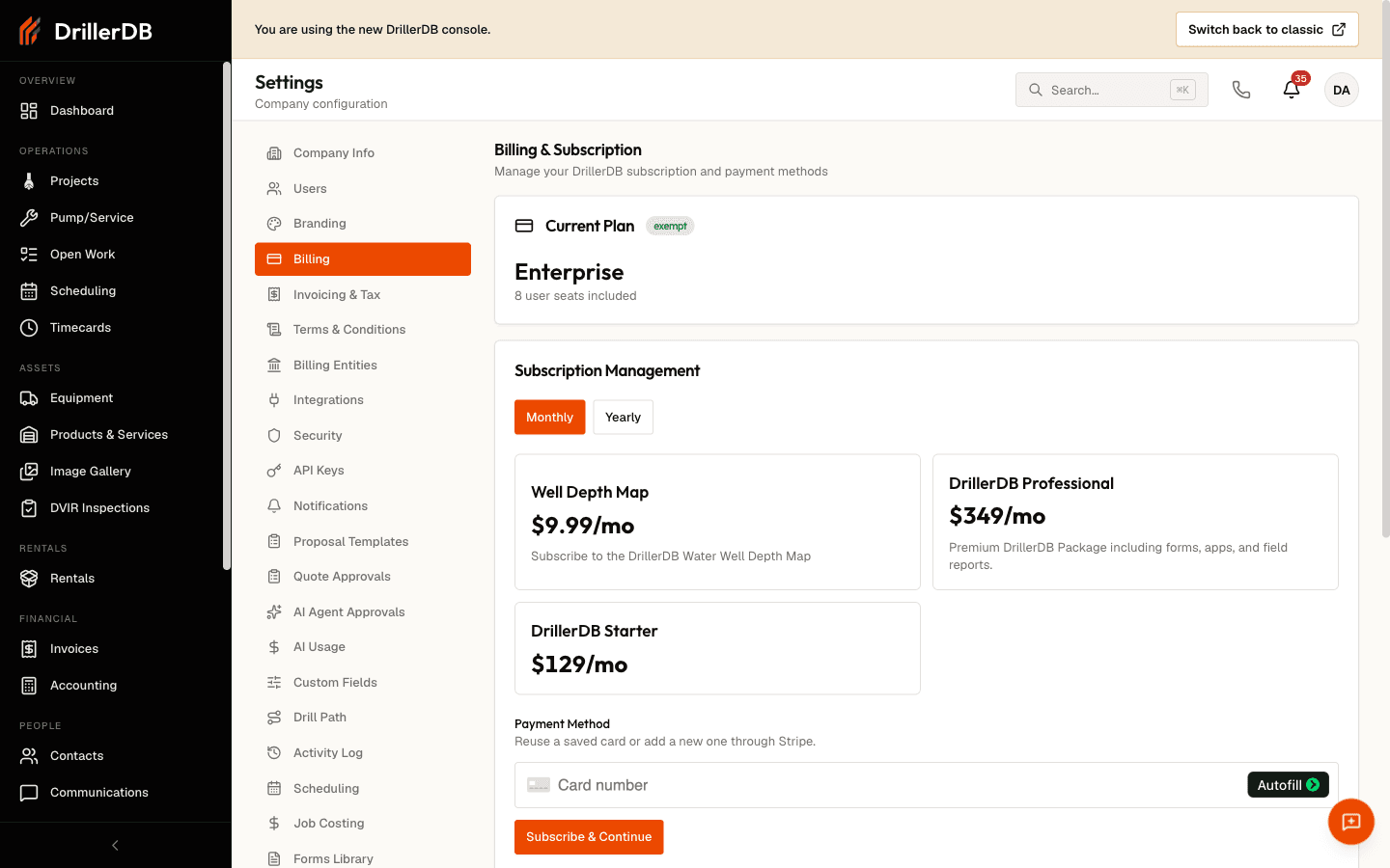 The Billing section of console Settings, showing Billing & Subscription. A Current Plan card reads Enterprise with an exempt badge and 8 user seats included. A Subscription Management panel has a Monthly/Yearly toggle and three plan cards - Well Depth Map at $9.99/mo, DrillerDB Professional at $349/mo, and DrillerDB Starter at $129/mo - above a Payment Method area with a Stripe card-number field and a Subscribe & Continue button.